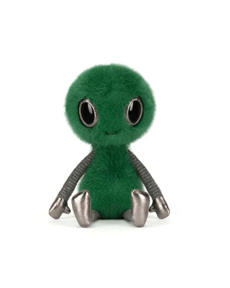 The jellycat zyllan alien plush toy has a round green furry head and body, large black eyes, a small smile, and metallic silver arms, legs, and feet. It is shown sitting upright against a white background.