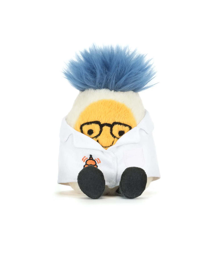 Meet the Jellycat amuseables boiled egg scientist outfit: a plush toy with blue fuzzy hair, yellow face, black glasses, and a white lab coat with an atomic symbol, sitting upright on a white background.