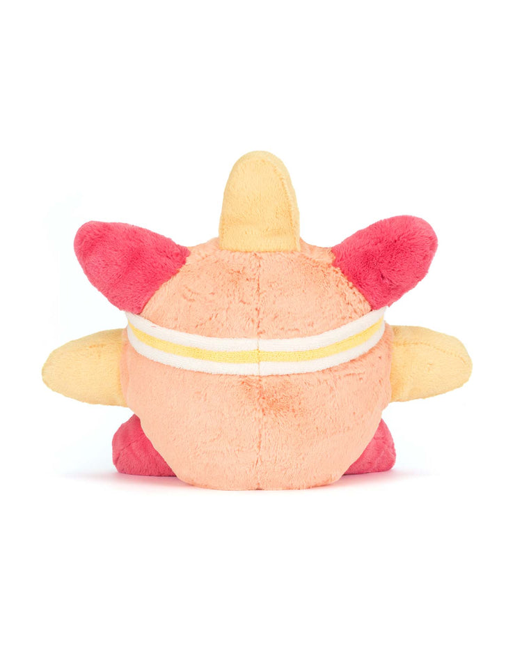 A round plush toy from Jellycat, the Amuseables Sun Roller Skates, features four red and yellow spikes and a yellow-and-white striped band. Shown from the back on a white background—perfect for fans or as a quirky boardwalk toy.