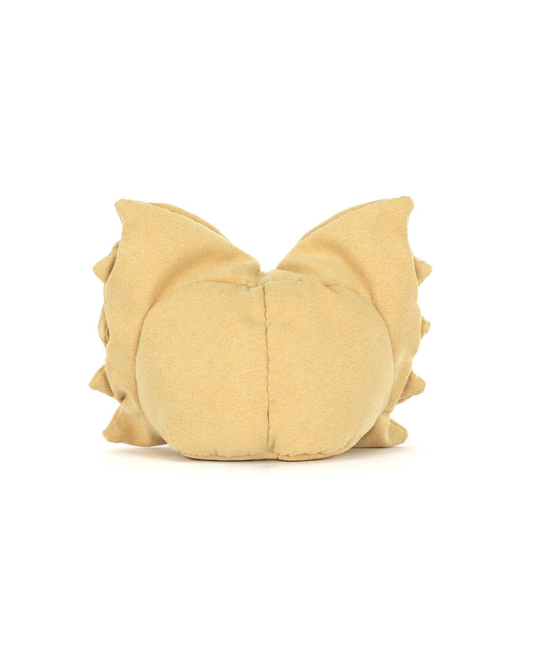The Jellycat amuseables farfalle is a whimsical beige, round plush toy with a charming bow tie, featuring two pointed ears and small edge spikes, resembling a creature from behind against a white background.