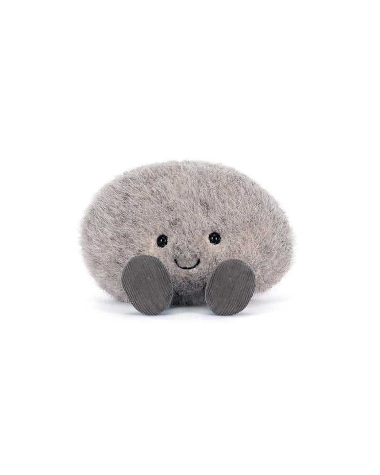The Jellycat Amuseables Pebble is a small, soft gray plush toy with black button eyes, a stitched smile, and flat feet—an adorable companion for wakeboarding—shown against a white background.