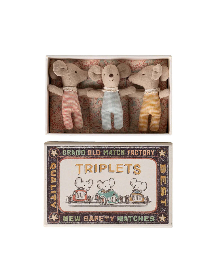 The maileg "triplets baby mice in matchbox - checker" features three baby mice in pastel overalls resting in a vintage-style matchbox bed with a checker pattern, labeled “Triplets” and decorated with charming race car mouse illustrations.