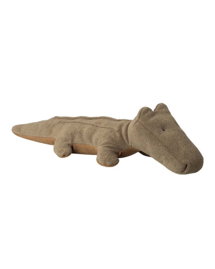 The maileg medium crocodile in olive green from the Safari Friends collection is a soft cotton plush toy with minimal stitched features, a flat design, and makes a perfect huggable stuffed animal.