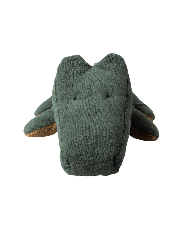 The "big crocodile in forest green, safari friends" by maileg is a huggable plush with minimal features and a brown underside on its side legs, shown front-facing against a white background—an ideal addition to any soft toy collection.
