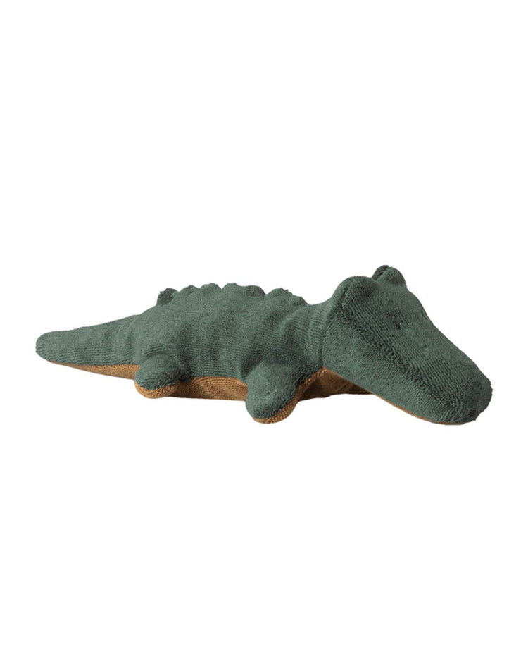 The maileg mini crocodile in forest green from the safari friends collection features a soft, textured surface and brown underside, making it an adorable huggable plush for any stuffed animal fan.