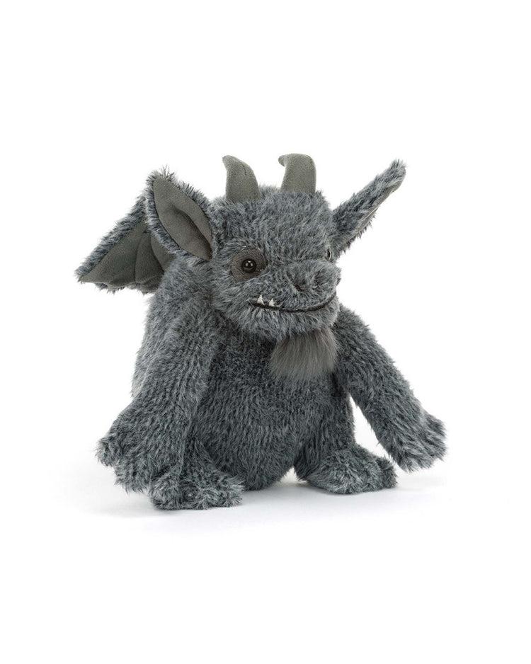 A plush toy from Jellycat called the Growlston Gargoyle, crafted from soft polyester plush and featuring gray fur, wings, horns, pointy ears, and a small beard, sits on a white background.