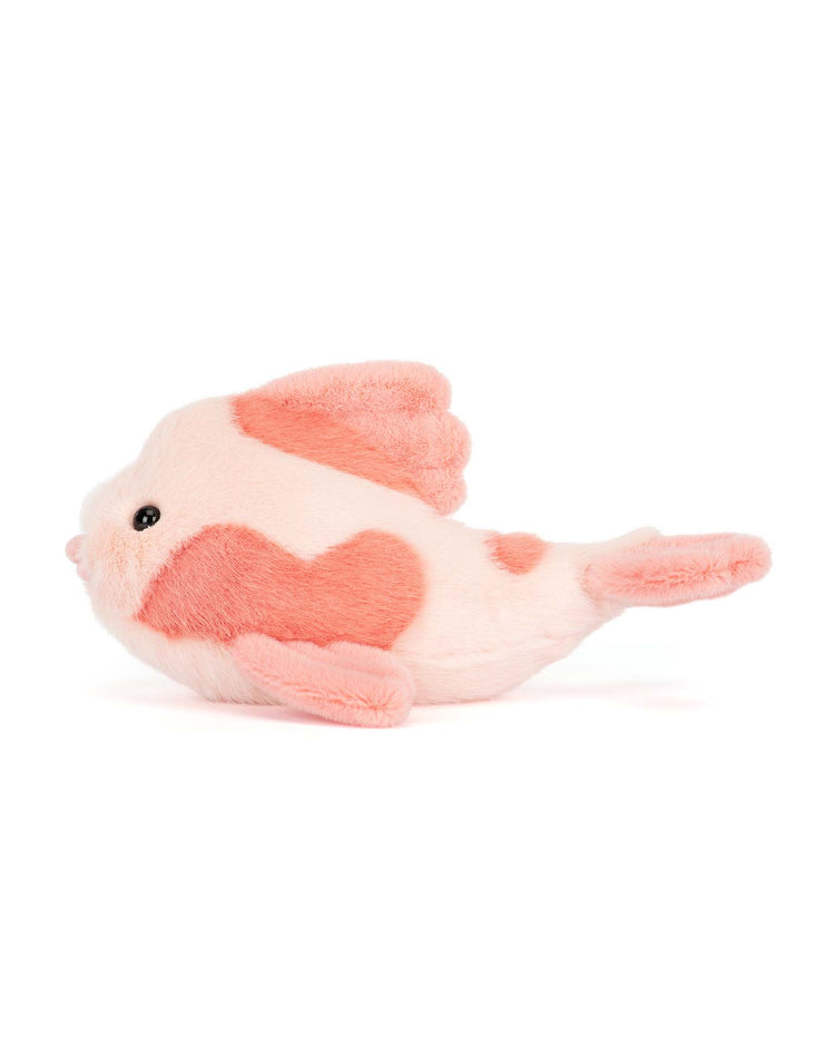 The jellycat fancy carp is a plush toy shaped like a pink and white fish with a heart-shaped patch, black eyes, and small fins—a charming accent for any refined space or furniture store.