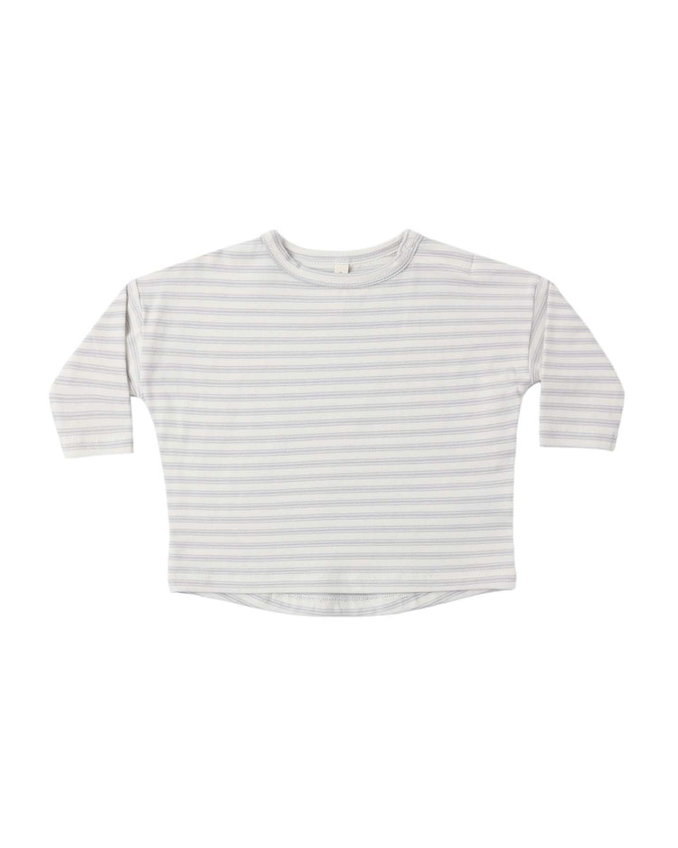 The long sleeve tee in cloud stripe by quincy mae is a baby clothing essential crafted from soft organic cotton, featuring light grey and white horizontal stripes, a relaxed fit, and a round neckline. It is shown laid flat on a white background.