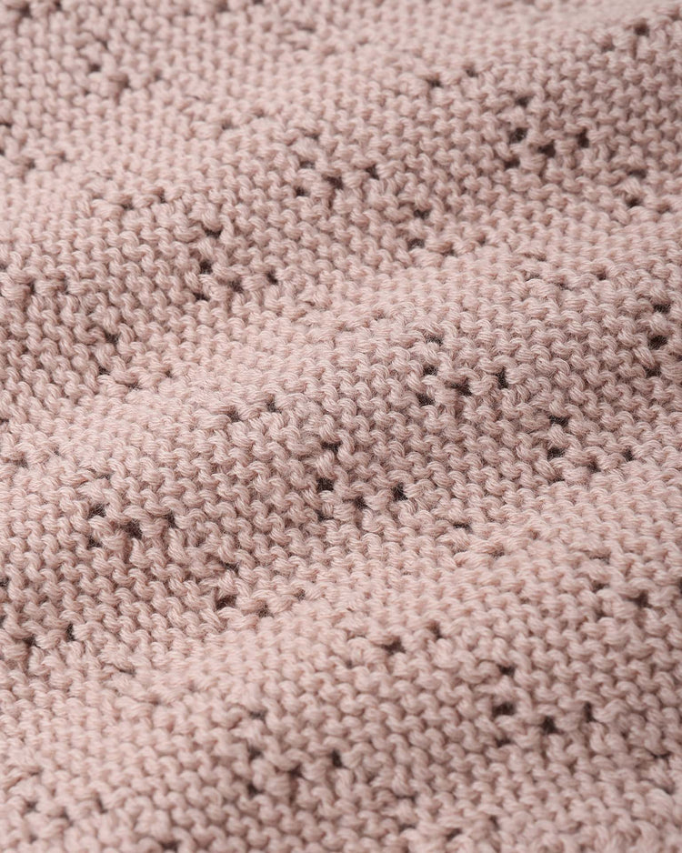 Close-up of the quincy mae knit bloomer in blush, made from soft organic cotton with a delicate pointelle pattern and cozy ribbed waist—perfect for comfort and style.