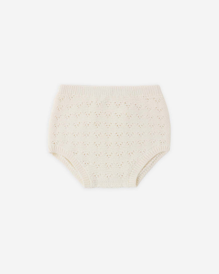 The quincy mae knit bloomer in natural is cream-colored with a delicate pointelle pattern, ribbed waist and leg openings, made from soft organic cotton, and shown on a plain white background.