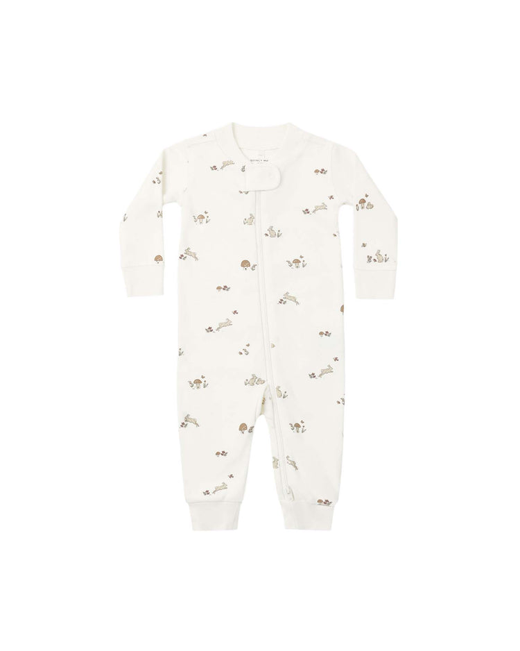 The zip long sleeve sleeper in bunnies by quincy mae features a cozy white design with long sleeves and a convenient front zipper, adorned with delicate light brown bunny and plant prints scattered across the fabric—perfect for keeping your little one comfortable all night long.