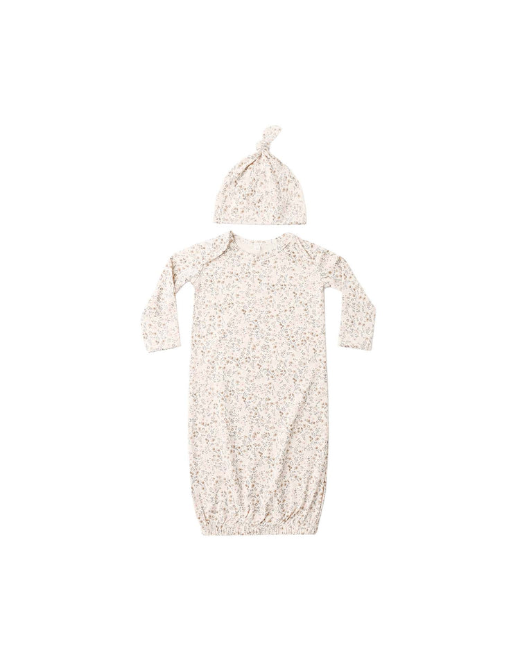 The quincy mae bamboo baby gown + hat set in bloom, featuring a long-sleeve gown with fold-over hand mitts and a matching knotted hat in a soft floral print, is displayed on a white background.