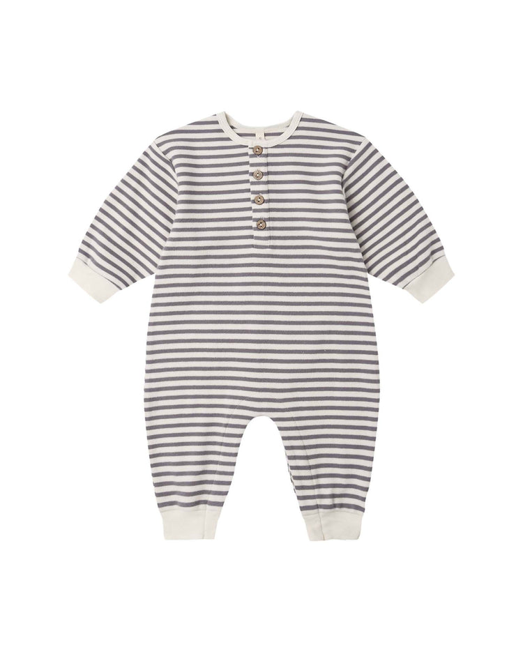 The relaxed jumpsuit in slate stripe by quincy mae is a long-sleeve organic cotton baby jumpsuit featuring gray and white horizontal stripes, cream cuffs, and a front button placket. The suit is shown laid flat against a white background.