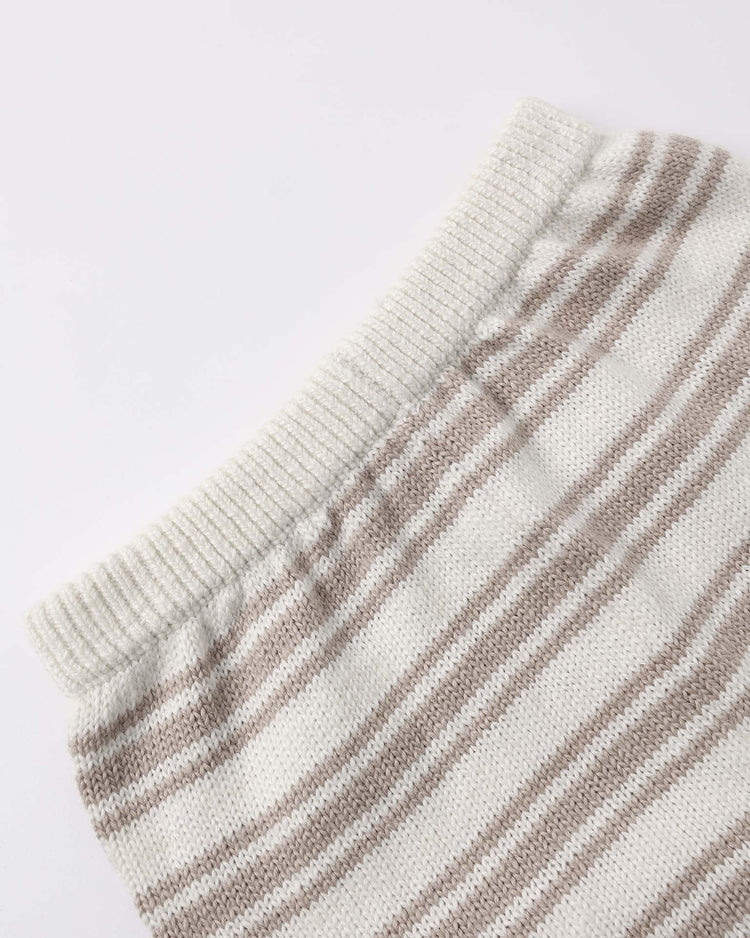 Close-up of the quincy mae relaxed summer knit set in oat stripe, showing a ribbed white collar and beige and white stripes. Made from organic cotton, the soft textured fabric is displayed on a white background.