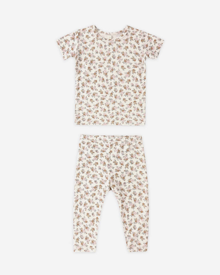 The quincy mae bamboo short sleeve pajama set in wildflower for kids features a soft bamboo fabric with an all-over small floral print in muted colors on white, displayed flat on a white surface.
