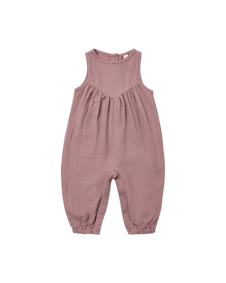 Maisie overall in mulberry by quincy mae—a sleeveless, lightweight baby romper featuring a gathered chest, button closures at the straps and inseam, and elasticized leg cuffs—is shown laid flat on a white background.