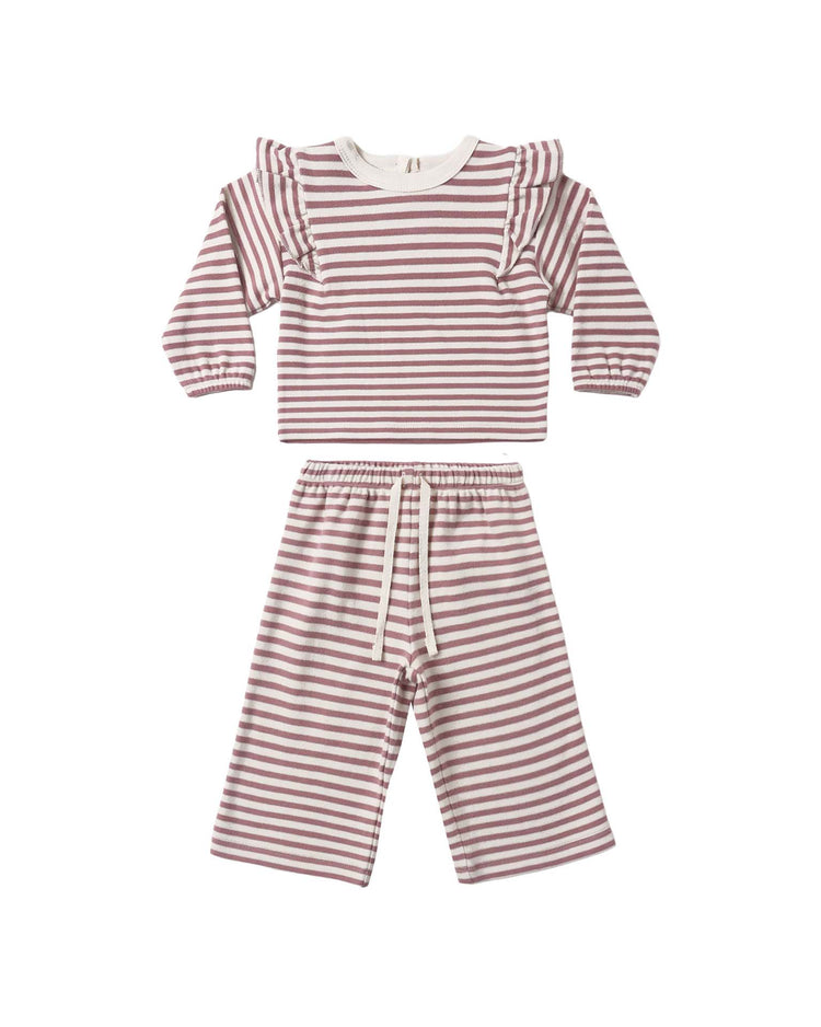 The ruffle cozy set in mulberry stripe by quincy mae features a children’s long-sleeve top with ruffled shoulders and horizontal mulberry and white stripes, paired with matching wide-leg drawstring pants. The set is displayed on a white background.