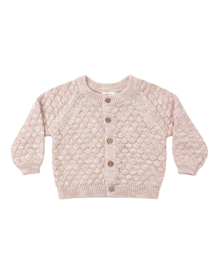 The quincy mae bubble knit cardigan in dusty rose speckle is crafted from soft organic cotton and features a textured, bubble-like pattern. Designed with long sleeves, ribbed cuffs and hem, and four brown buttons down the front, this charming baby sweater is shown on a white background.