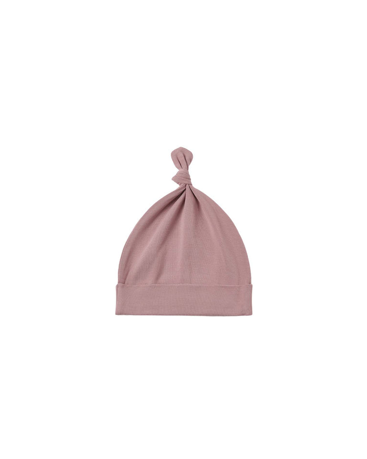 A bamboo knotted baby hat in mulberry by Quincy Mae, featuring a folded brim and a small knot at the top, displayed on a white background.