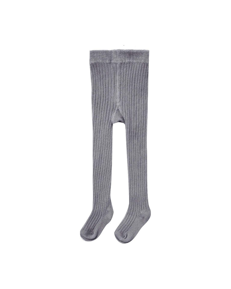 A pair of "tights in slate" by quincy mae, featuring a light gray rib knit design and footed style for children, is laid flat on a white background.