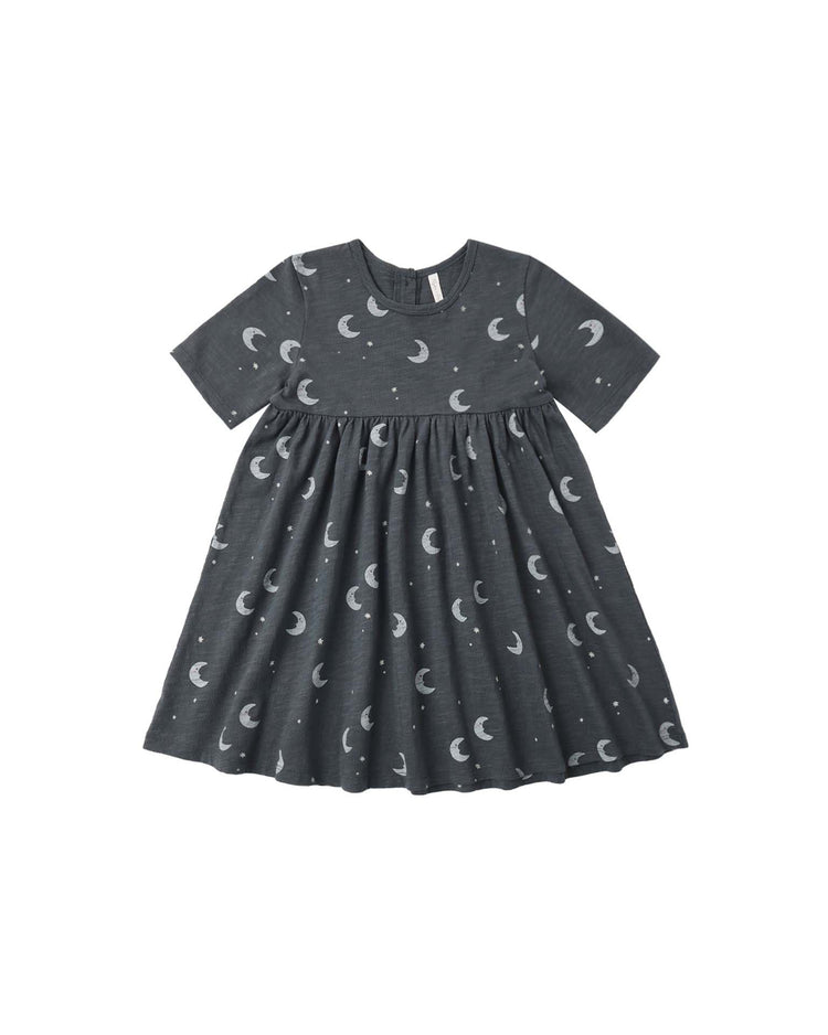 A short-sleeved, dark gray PREORDER finn dress in moons by rylee + cru for children, crafted from soft cotton jersey with a gathered waist and an all-over print of white crescent moons and small dots.