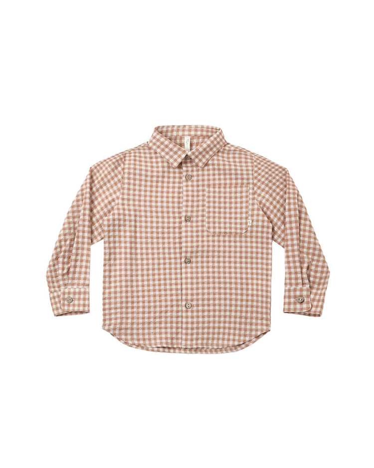 The collared long sleeve shirt in fawn gingham by rylee + cru features a brown and white checkered pattern, a front pocket, button-up closure, and is expertly crafted from 100% cotton. Displayed on a white background.