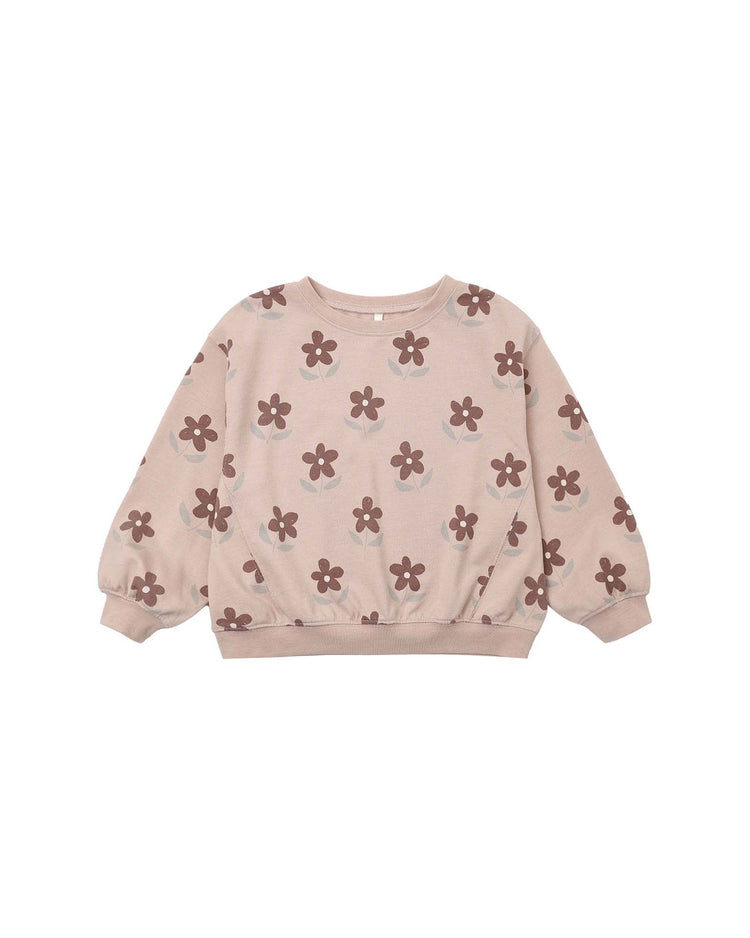 The rylee + cru oversized sweatshirt in daisy is a light pink children’s crewneck pullover featuring brown daisy print flower patterns, long sleeves, ribbed cuffs, and a ribbed hem, displayed on a white background.
