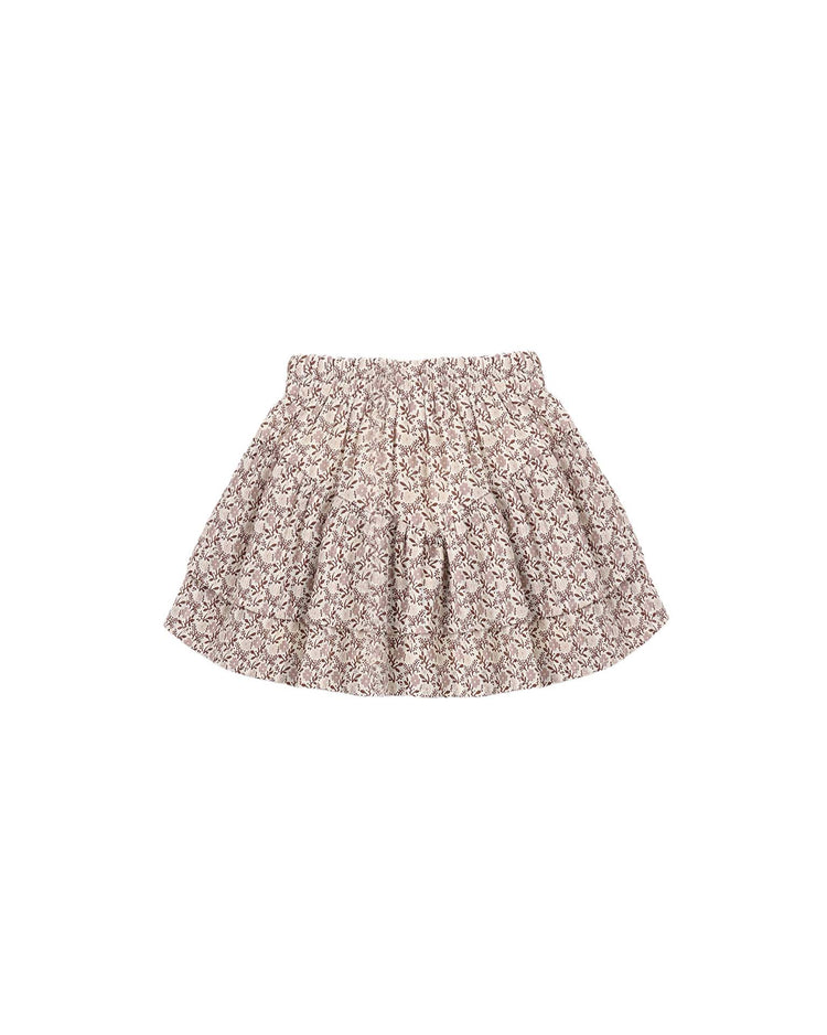 Introducing the rylee + cru tiered mini skirt in primrose—a short, flared skirt with a gathered, elastic waistband and a charming small floral print in light brown and beige tones. Made from 100% cotton for breathable comfort, this skirt is perfect for warm-weather outings and is beautifully displayed on a white background.