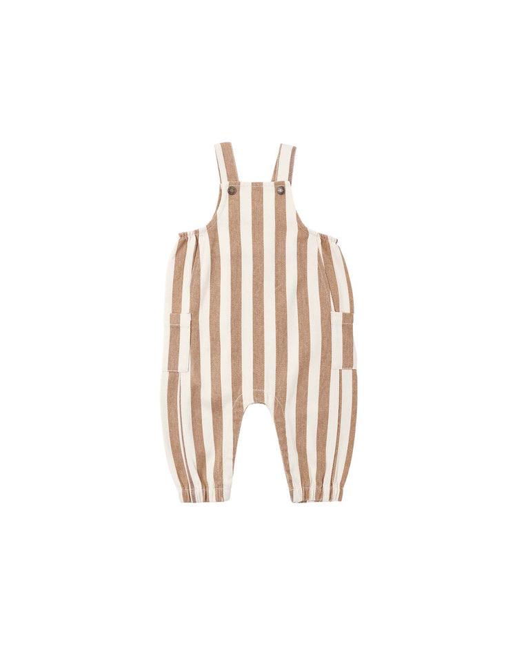 The rylee + cru cargo baby overall in fawn pinstripe, featuring tan and white vertical stripes, crafted from 100% cotton pinstripe denim with buttoned shoulder straps and side pockets, is laid flat on a white background.