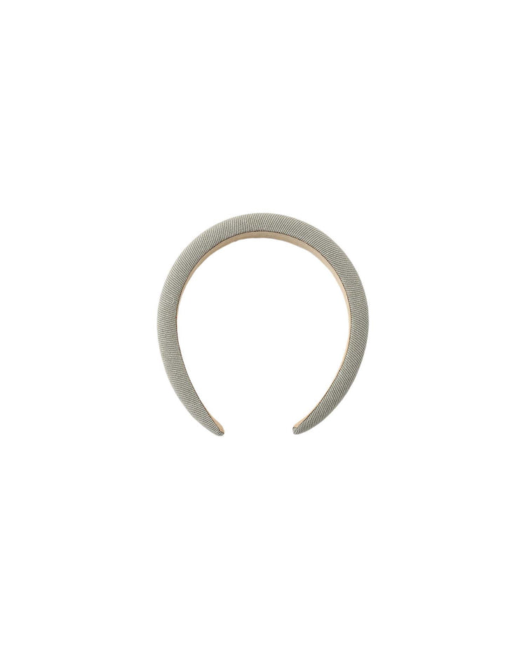 A silver textured cuff bracelet with an open front, viewed from above on a white background, pairs beautifully with the rylee + cru padded headband in dark sage for a sophisticated, modern look.