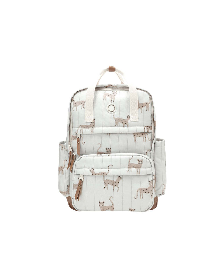 Discover the "backpack in leopard" by rylee + cru—a stylish white backpack adorned with a playful brown leopard pattern. Featuring beige straps, two front zipper pockets, and two side pockets, this durable polyester bag is perfect for everyday adventures.