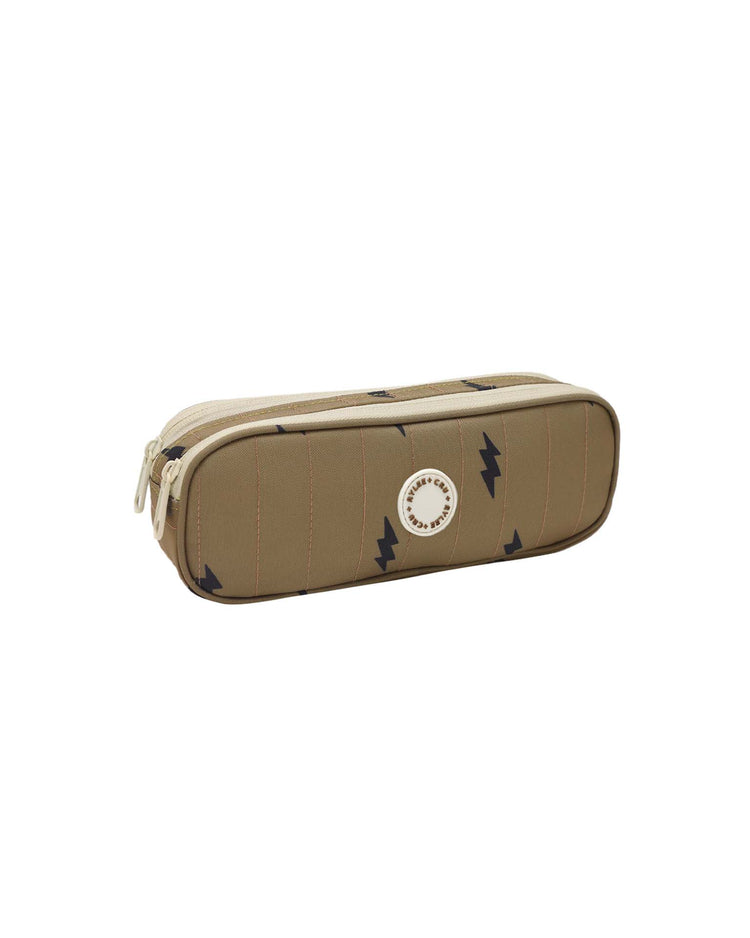 The pencil pouch in bolts by rylee + cru features a rectangular brown design with a zipper, accented by navy lightning bolt patterns and a circular white logo on one side—making it the perfect pencil pouch and an essential addition to your school supplies.