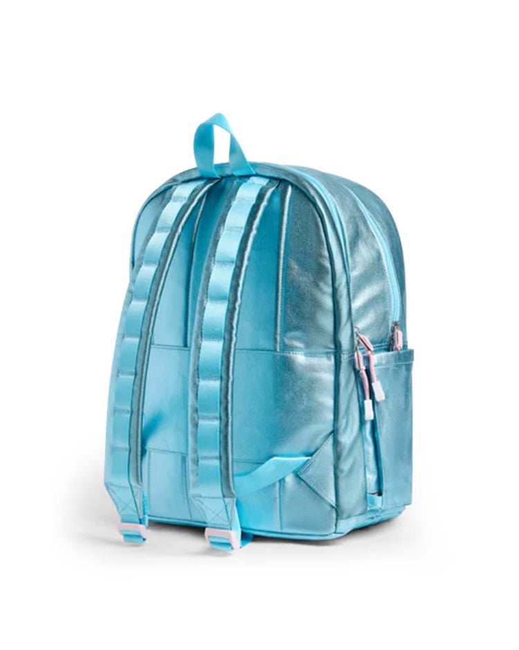 A kane double pocket backpack in clouds from state bags is shown from the back, featuring adjustable padded straps, a small side pocket, and a top handle. Perfect as a stylish school backpack, it is set against a plain white background.