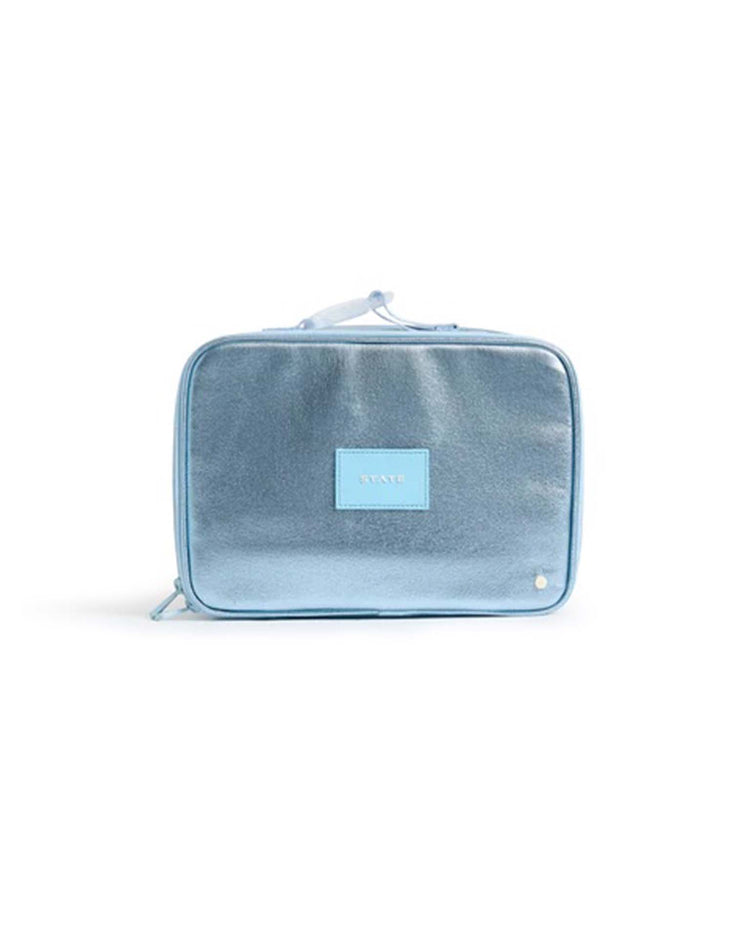 The rodgers lunch box in blue from State Bags features a light blue rectangular design with a zipper closure, a small top handle, and a matching light blue front label. With its minimalist aesthetic and subtle sheen characteristic of State Bags, this lunch box combines functional elegance—ideal for organizing essentials or stylishly carrying your insulated lunch in everyday life.