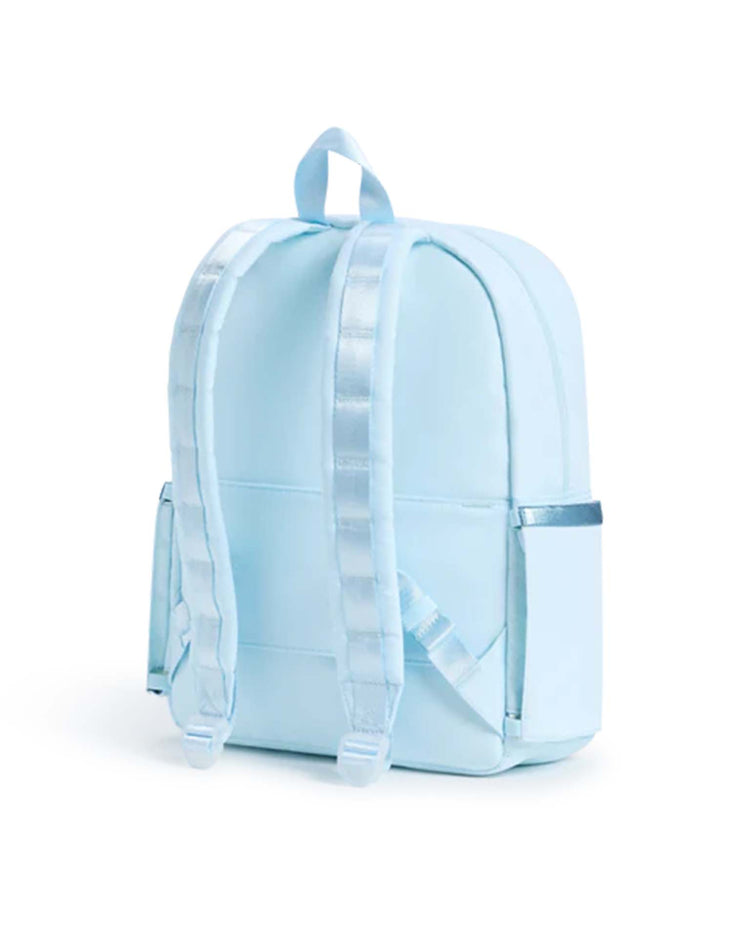A Kane Backpack in Rainbow Cloud by STATE Bags, featuring silver shoulder straps and two side pockets, is displayed on a white background.