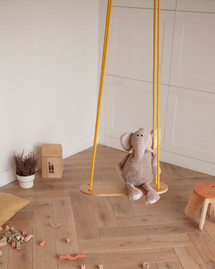 Little babai play natural swing in sand