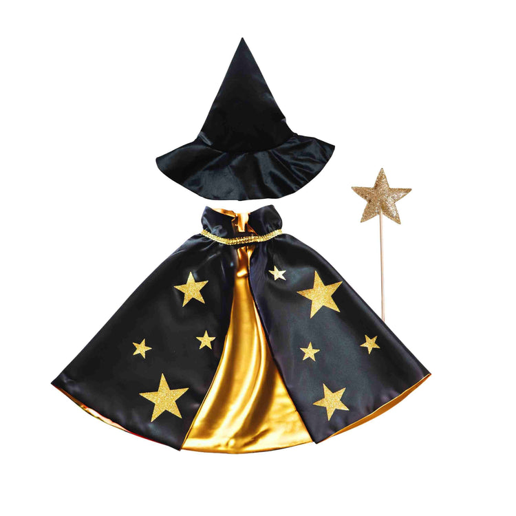 The Spellbound Witch Costume Set in Black by Bailey and Ava includes a velvet witch hat, glitter star cape, and star wand, all with gold stars on a white background.