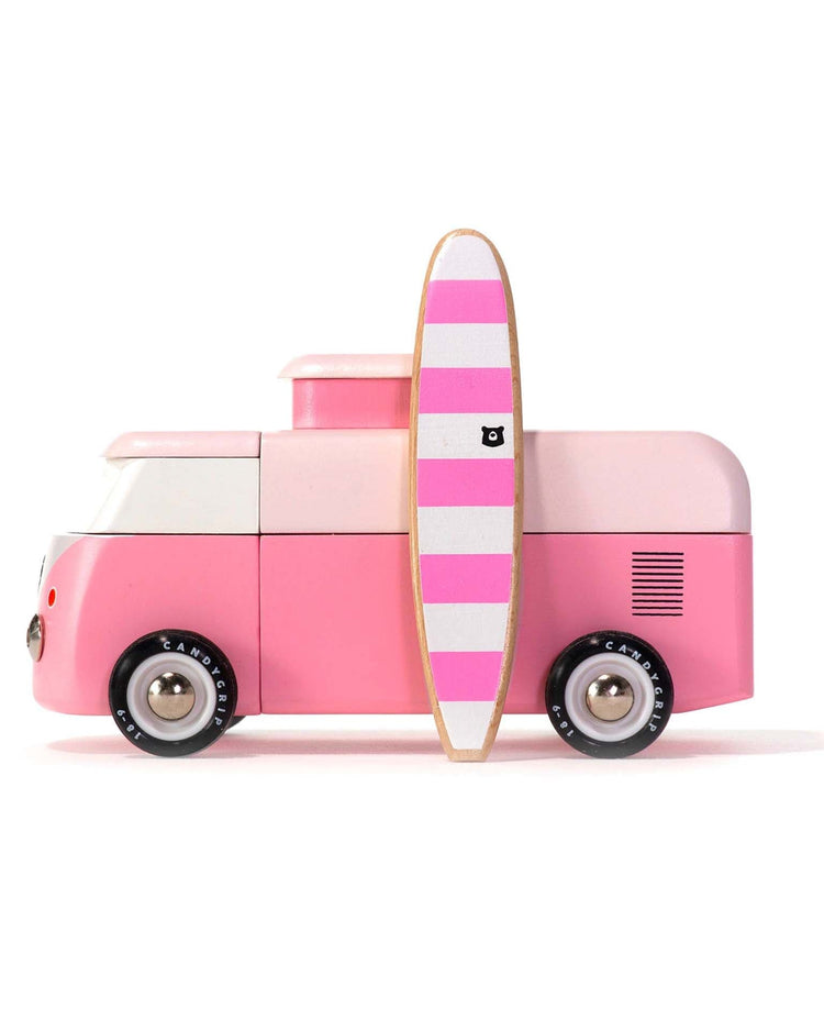 The candylab VW beach bus pink is a modular magnetic toy van with black wheels and a pink-and-white striped surfboard on its side, shown in profile against a plain white background.