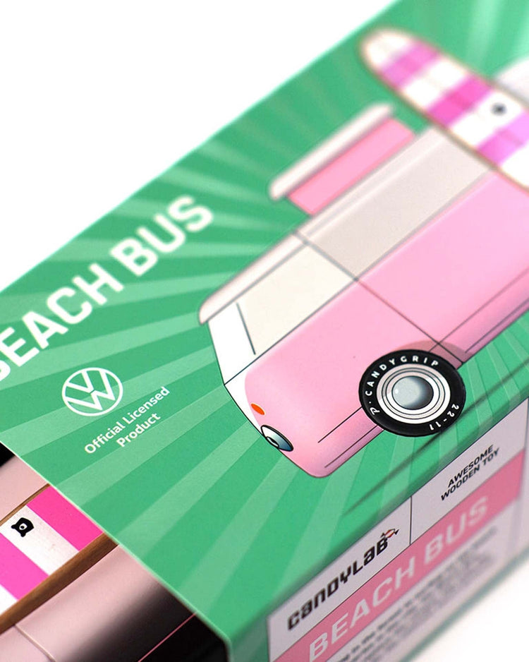 Close-up of the candylab VW beach bus pink, a modular magnetic toy in colorful packaging. The box features an illustrated wooden surf van, Volkswagen logo, and official licensing details.