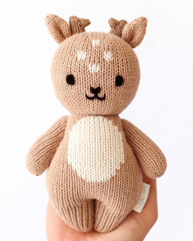 Little cuddle + kind play baby fawn