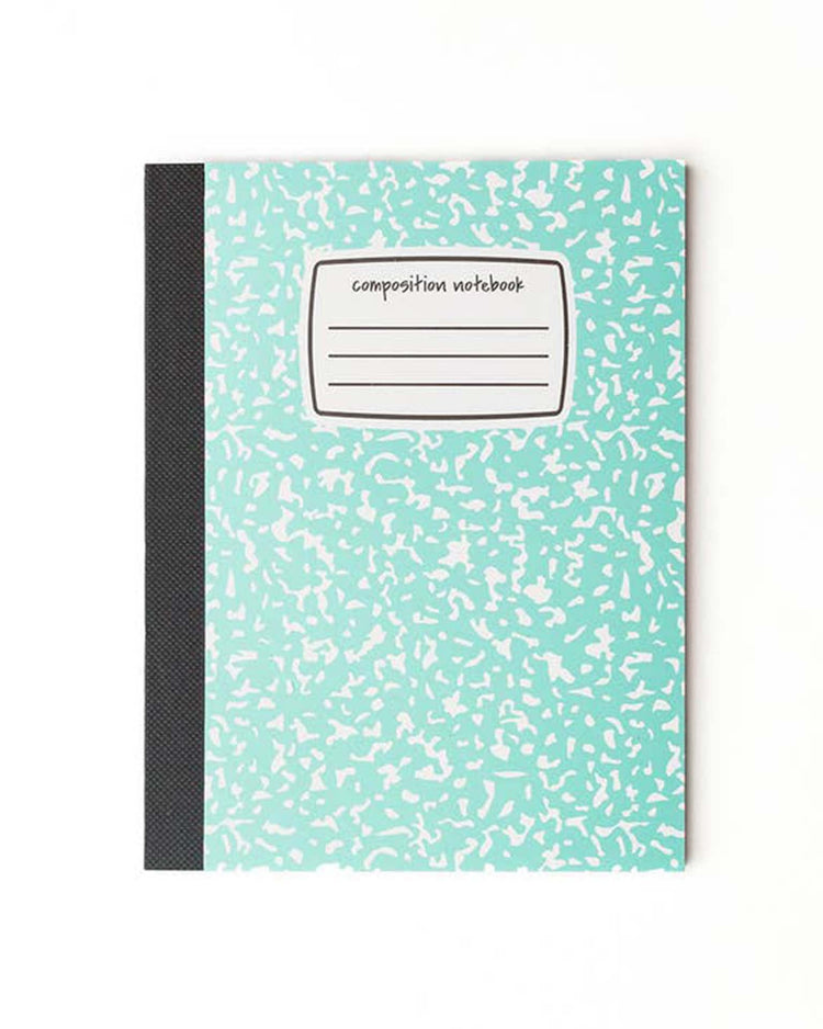 A mint mini composition notebook with a black spine and an empty label on the cover, perfect for school or journaling. This charming item is brought to you by daydream society.