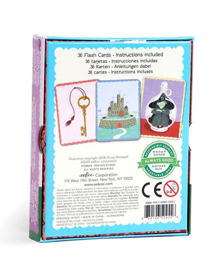 Back of a box displaying a key, a castle, and a person in a cloak from the "fairytale mix-ups create a story" by eeboo. Features text in multiple languages, company information, and has a green quality assurance seal. Ideal for fairy tale enthusiasts looking to boost their critical thinking skills.