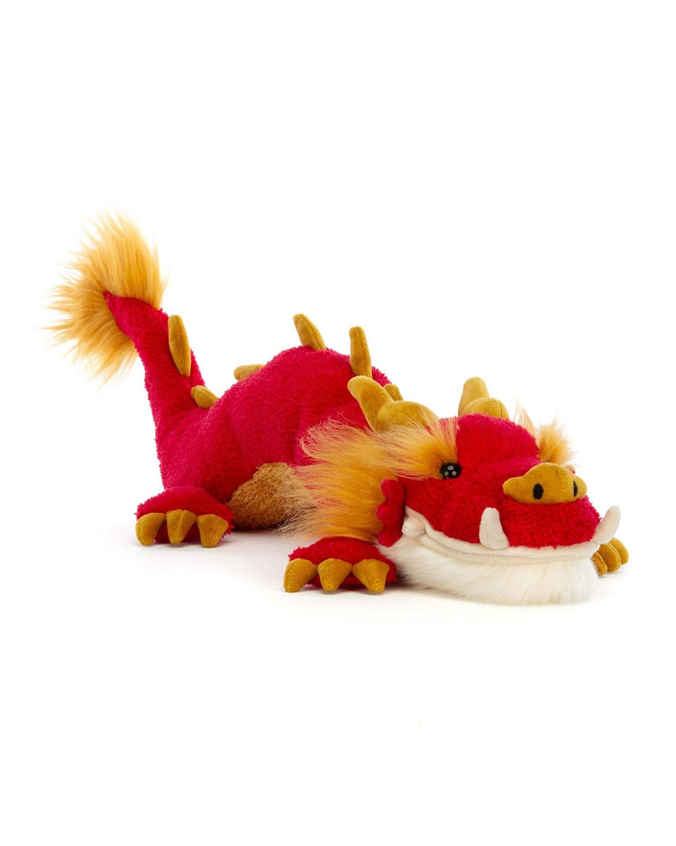Introducing the Festival Dragon by Jellycat, a plush toy designed to resemble a red dragon with yellow accents, lying on its stomach. This stuffed animal is perfect for any celebration.