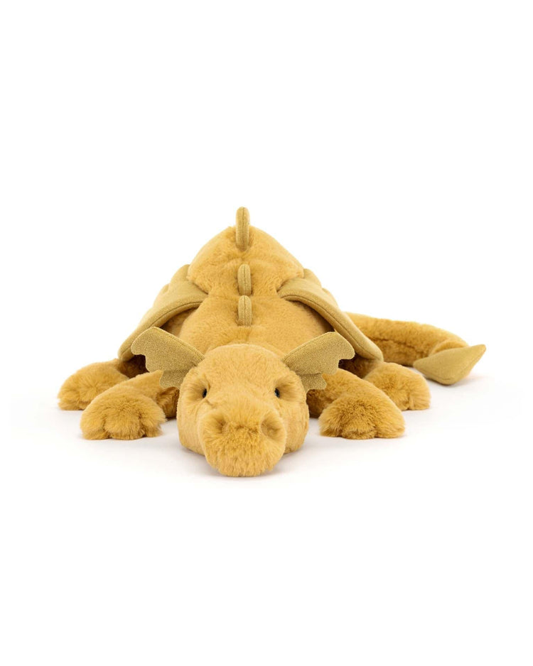 A Jellycat Golden Dragon plush toy, featuring a soft and textured body, lies flat on its belly and is photographed from the front against a plain white background—perfect for sparking magical dreams.