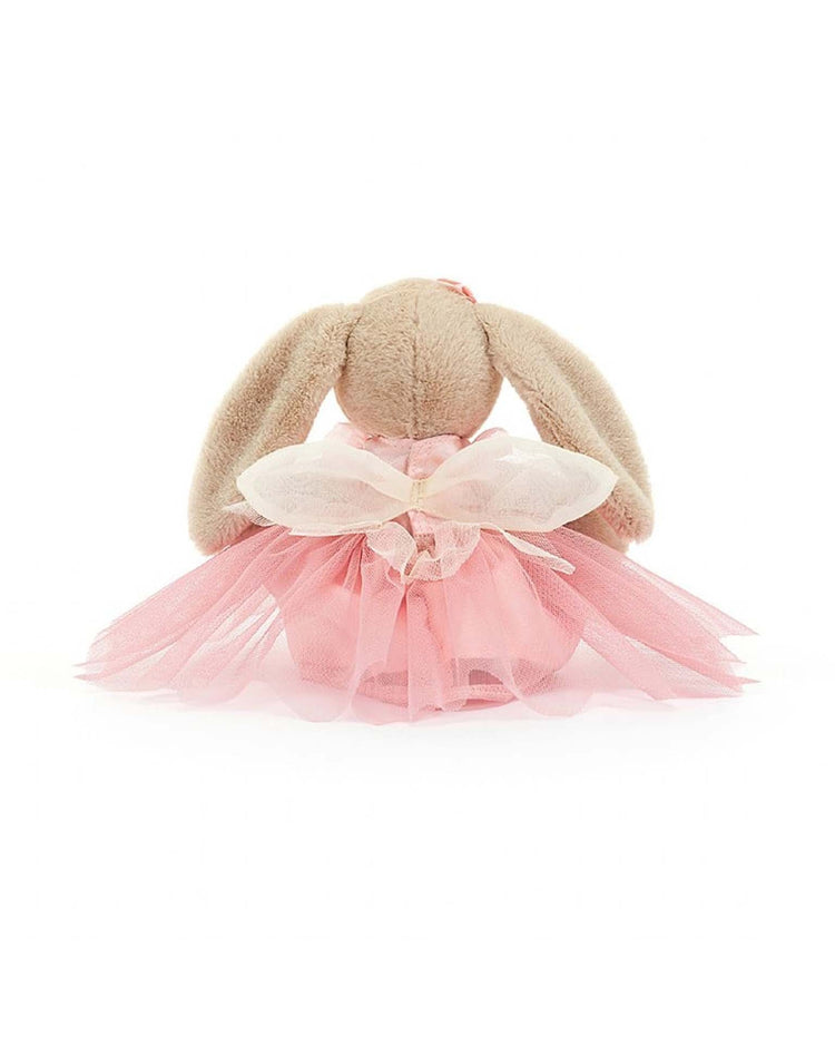A plush Jellycat Lottie Bunny Fairy, dressed in a pink tutu dress and sheer wings, viewed from the back against a white background.