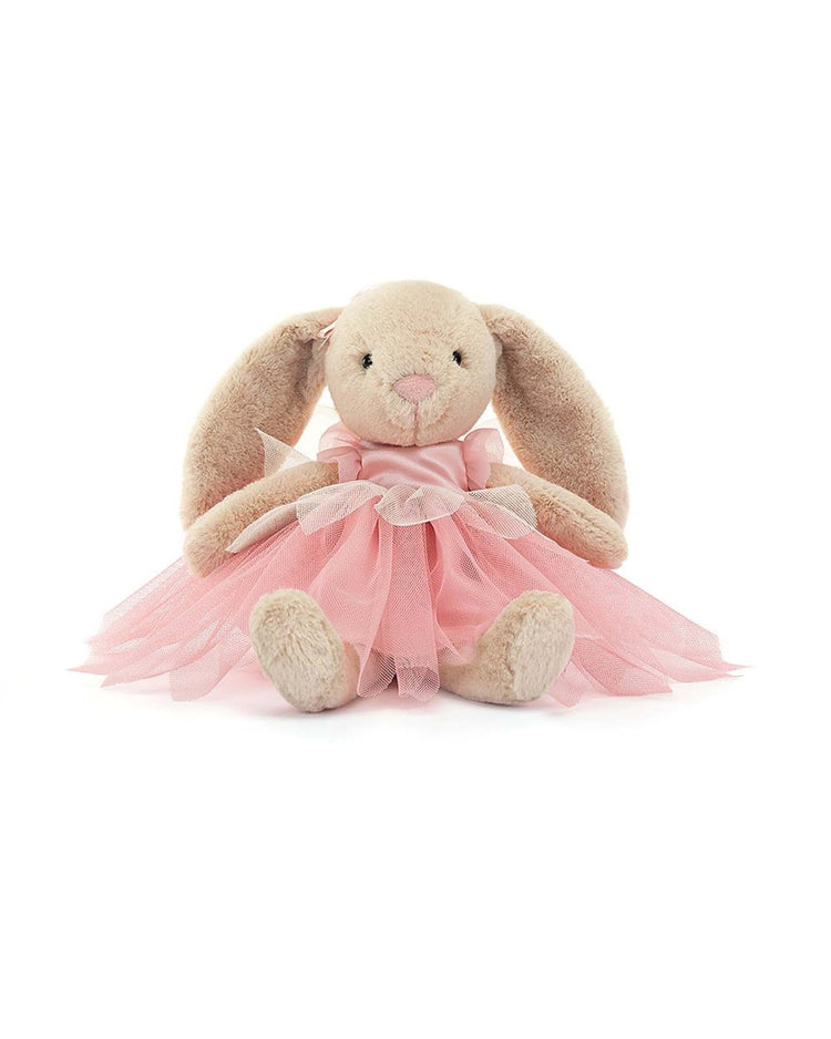 A soft, plush Jellycat Lottie Bunny Fairy wearing a pink tulle dress with a bow, sitting upright against a white background.