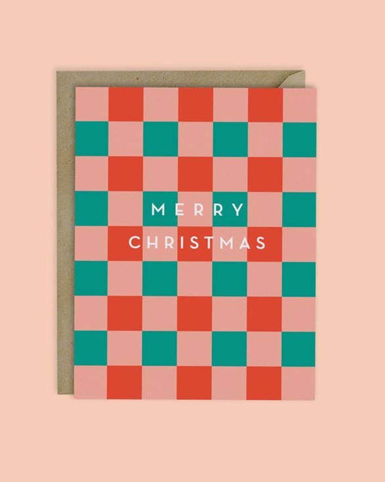 Introducing the "Christmas Checkerboard Card" by MellowWorks, showcasing a festive checkerboard design in vibrant red, green, and pink hues. The words "Merry Christmas" are elegantly displayed in white on high-quality matte felt stock.