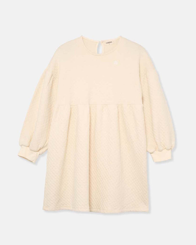 The creta diamond quilted dress in ivory by cozmo features long sleeves, a round neckline, gathered waist, and single back button closure—crafted from cozy fabrics as part of the Back to Cozmo collection.