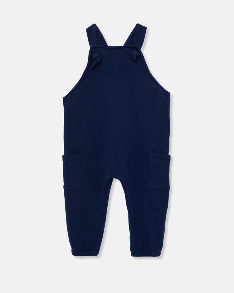 The ronie knit baby overalls in navy from cozmo feature shoulder straps, two front pockets, and a straight-leg design, crafted with soft textiles and shown on a plain white background.