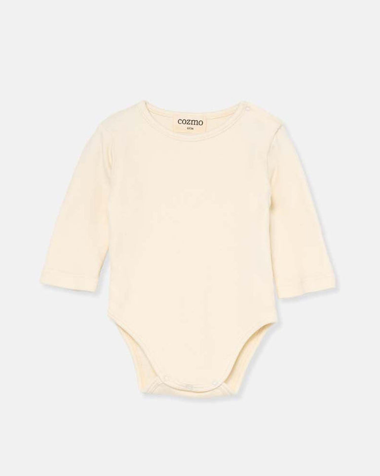 The cozmo sasha jersey newborn bodysuit in ivory features long sleeves and bottom snap buttons, made from soft, warm fabric and shown on a simple light background.